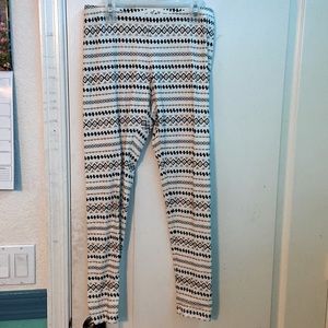 | Cat & Jack | White, black, and gold patterned leggings.